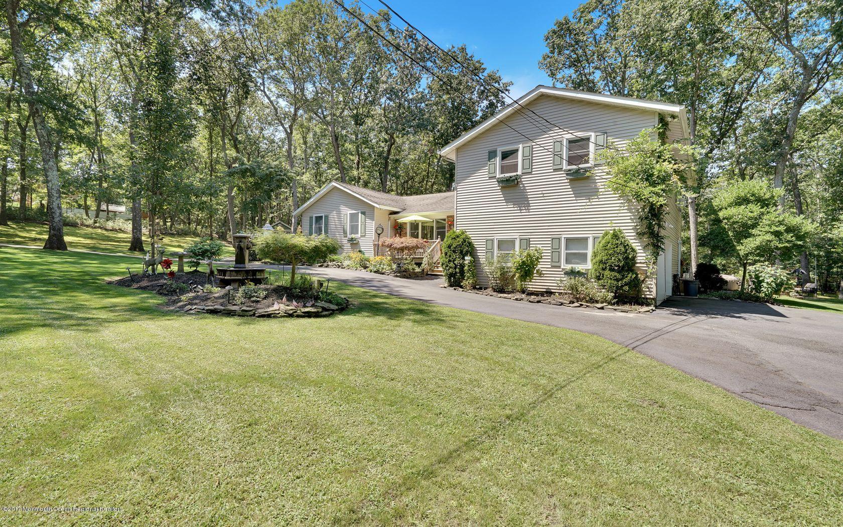 340 Jackson Pines Road Jackson, NJ 08527 - Photo 37 of 41 a front view of a house with a yard and trees