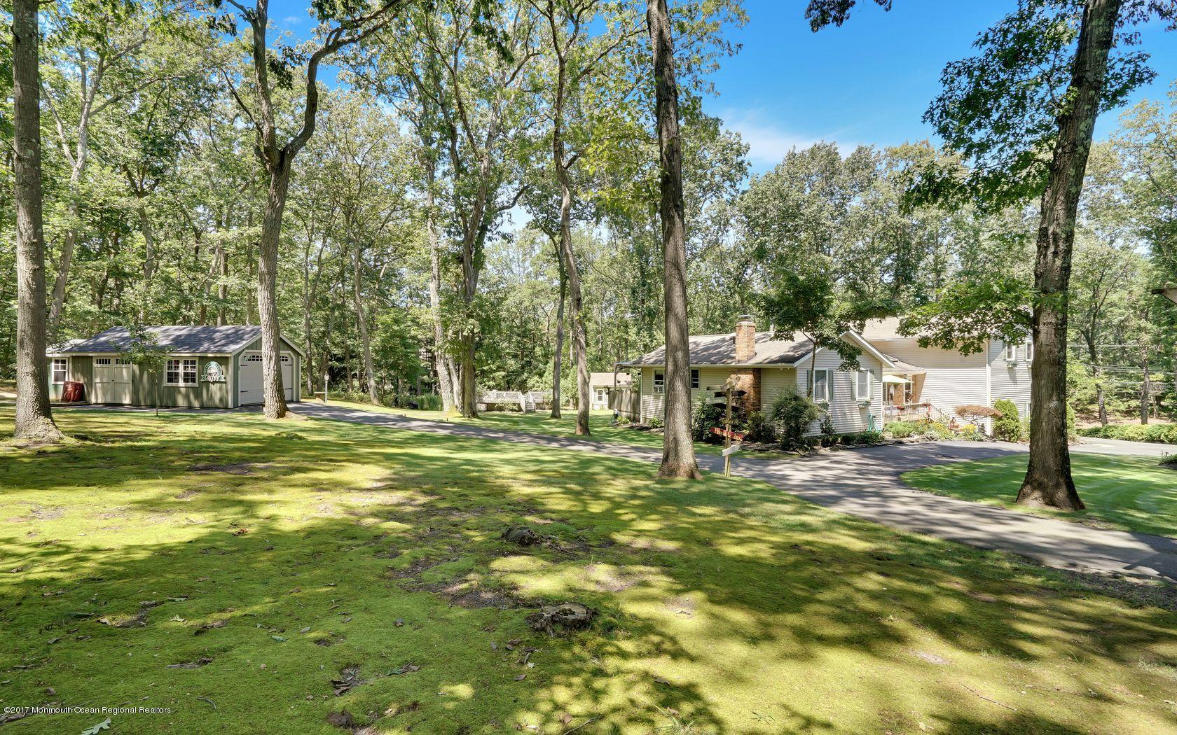 340 Jackson Pines Road Jackson, NJ 08527 - Photo 41 of 41 a view of a house with a yard and sitting area