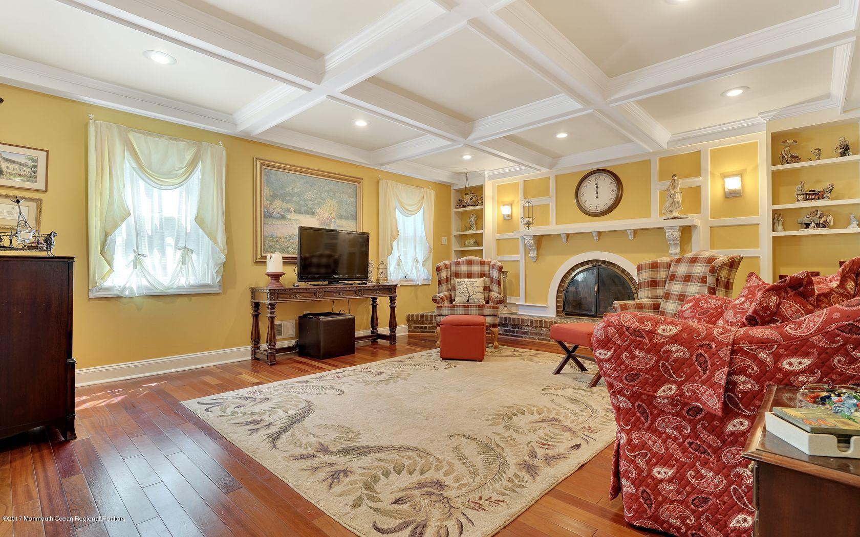 340 Jackson Pines Road Jackson, NJ 08527 - Photo 6 of 41 a bedroom with furniture and a fireplace