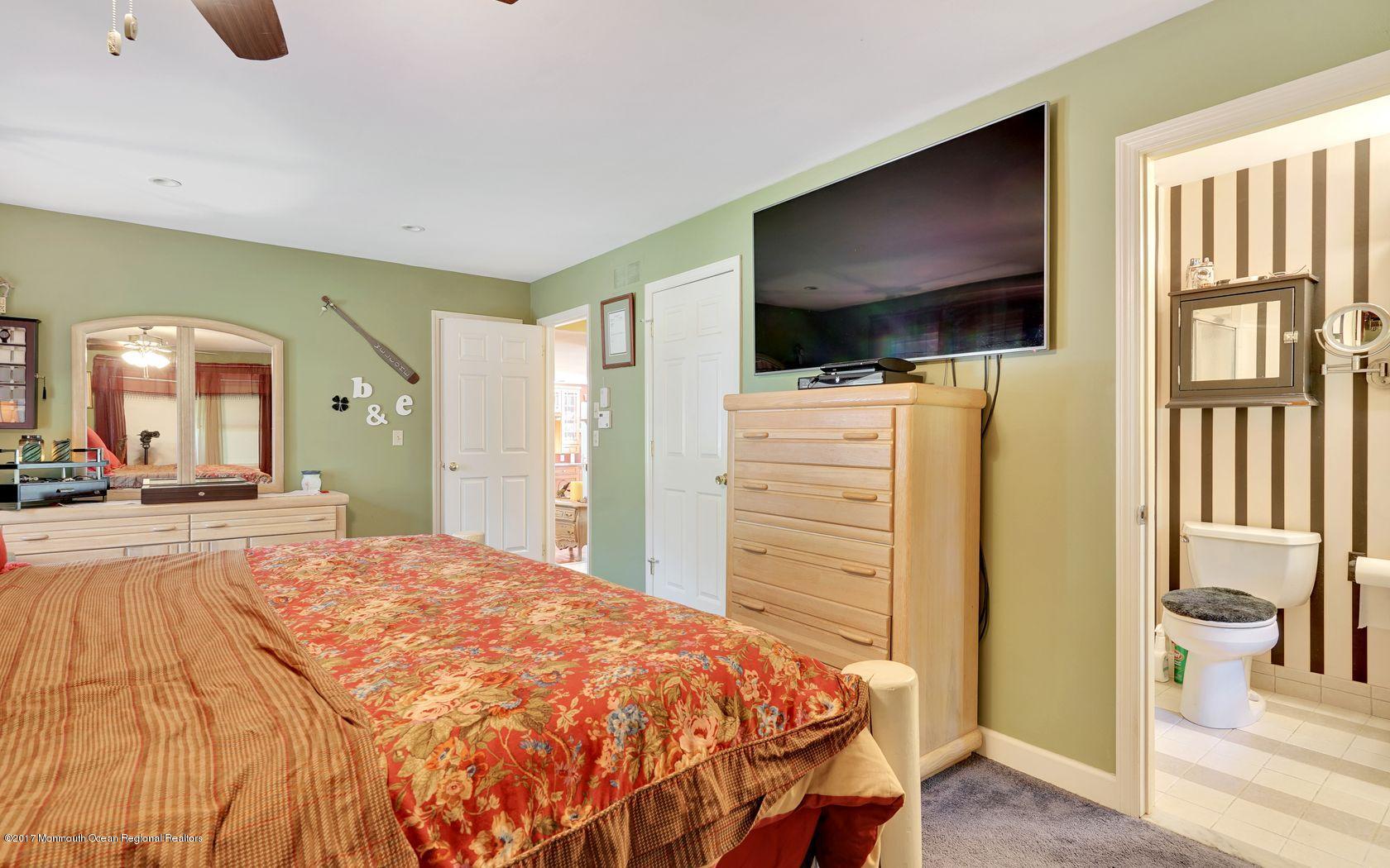 340 Jackson Pines Road Jackson, NJ 08527 - Photo 10 of 41 a bedroom with a bed and a flat screen tv