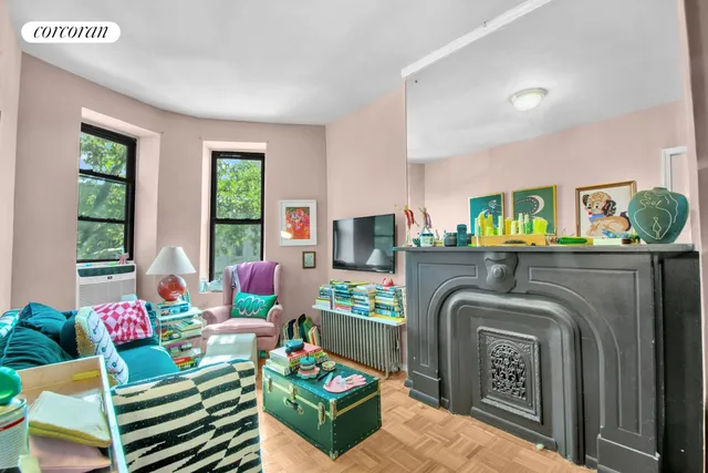 a view of a chair and table in the back yard of the house