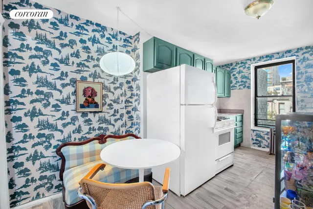 a kitchen with a stove and a window