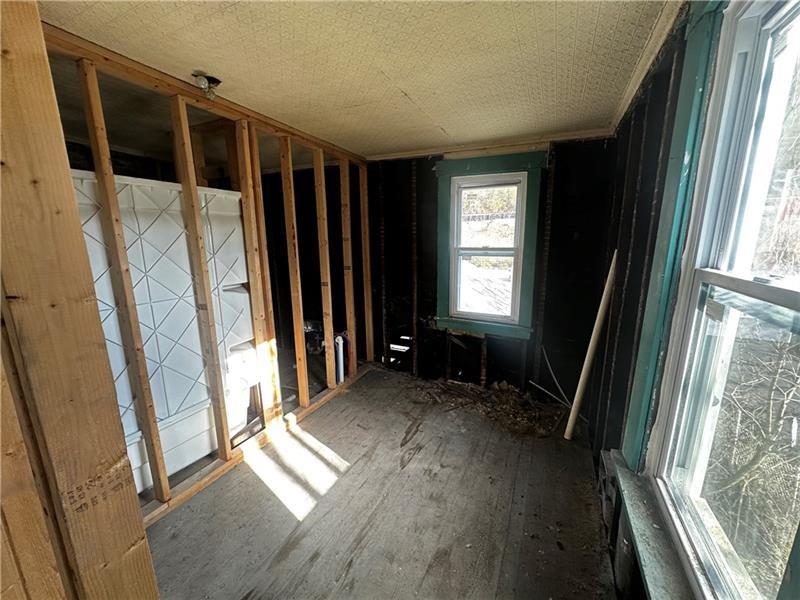 357 Baldwin Road Pittsburgh, PA 15207 - Photo 15 of 25 a view of hallway with furniture and a window