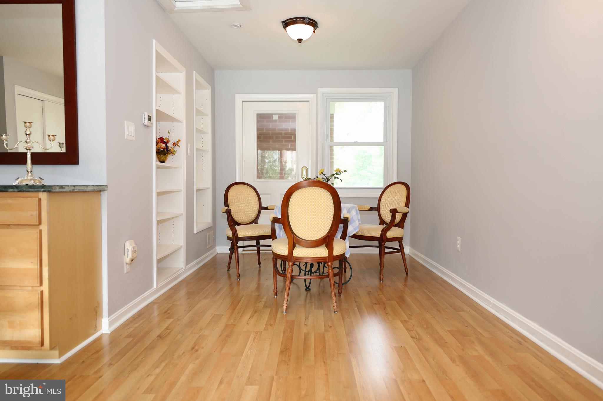 13105 Holdridge Road Silver Spring, MD 20906 - Photo 5 of 18 Built-in shelving and exit to rear yard