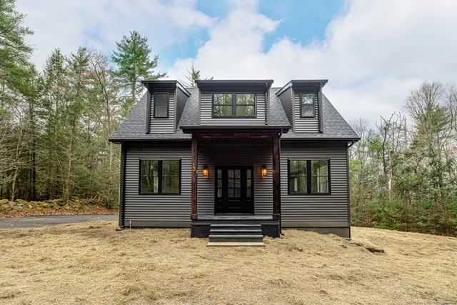 a house with trees in front of it