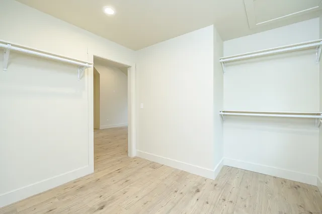 an empty room with wooden floor