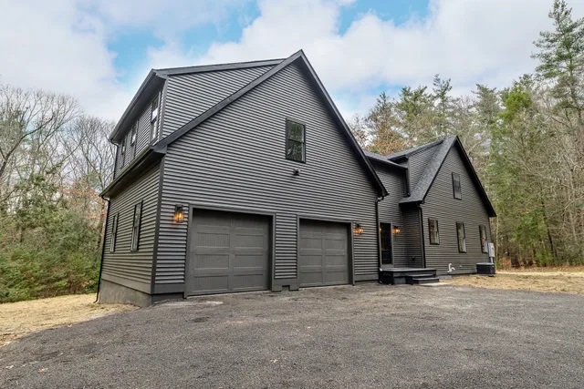 a front view of a house with a garage