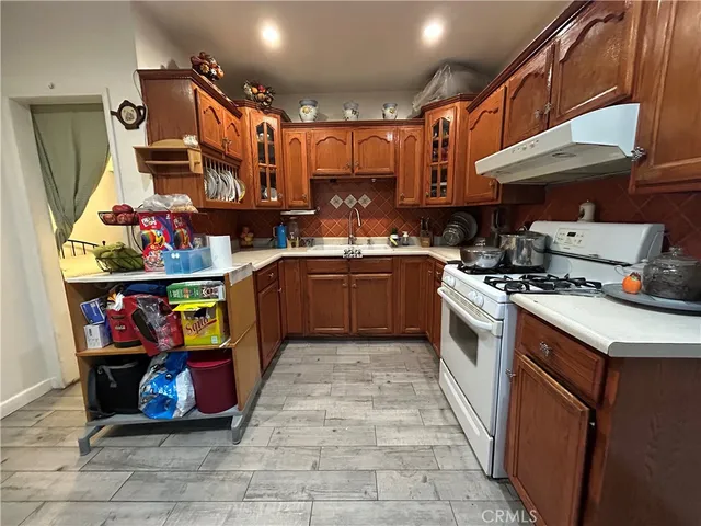 a bedroom with a dresser and a closet