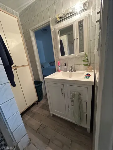 a bedroom with a bed and a walk in closet