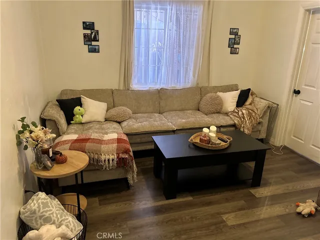 a kitchen with granite countertop a refrigerator stove top oven and sink
