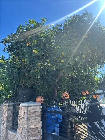 a living room with furniture gym equipment and a large window