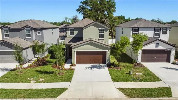 a front view of a house with yard