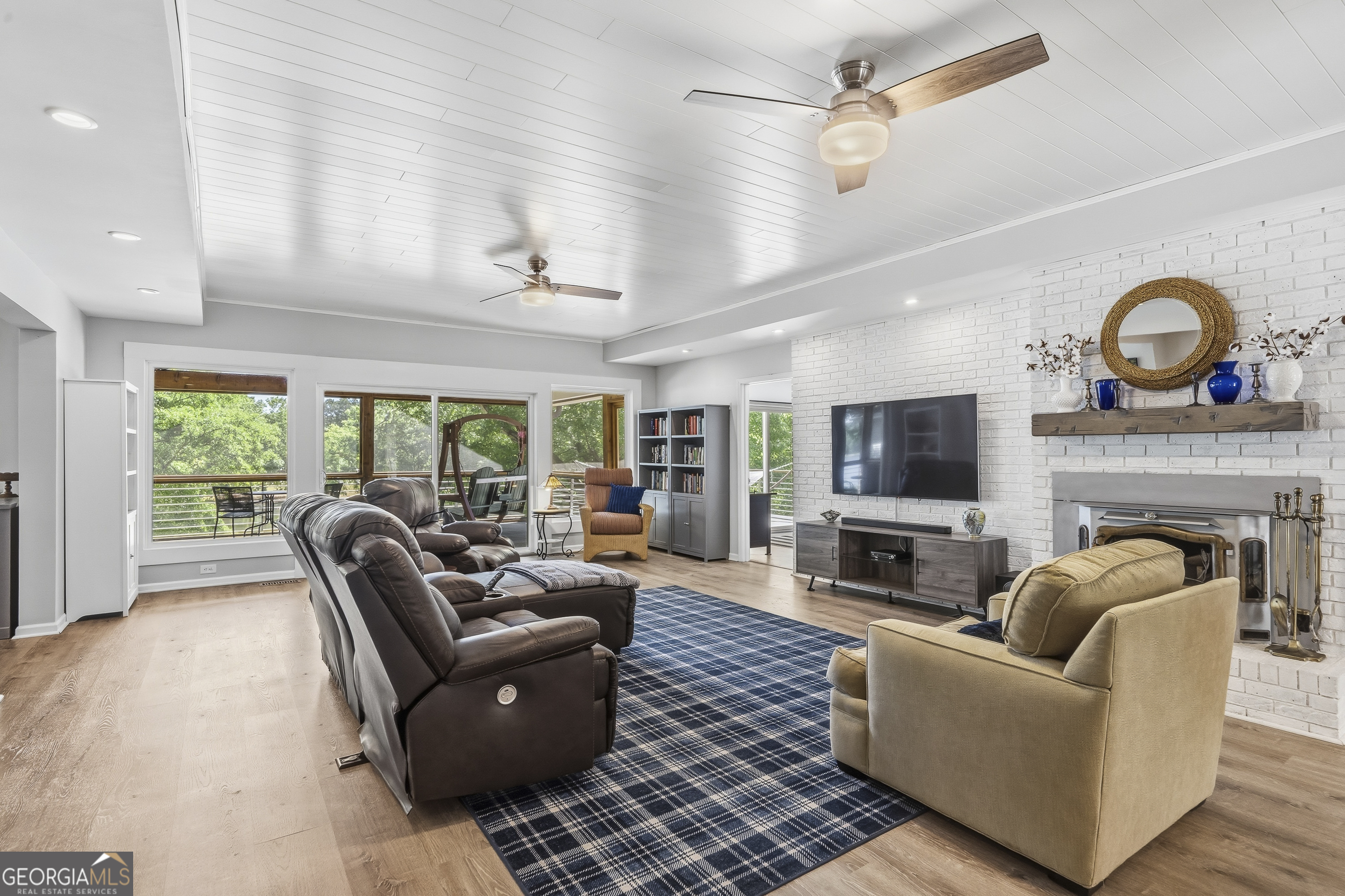 118 Hickory Point Buckhead, GA 30625 - Photo 20 of 69 a living room with furniture a fireplace and a flat screen tv