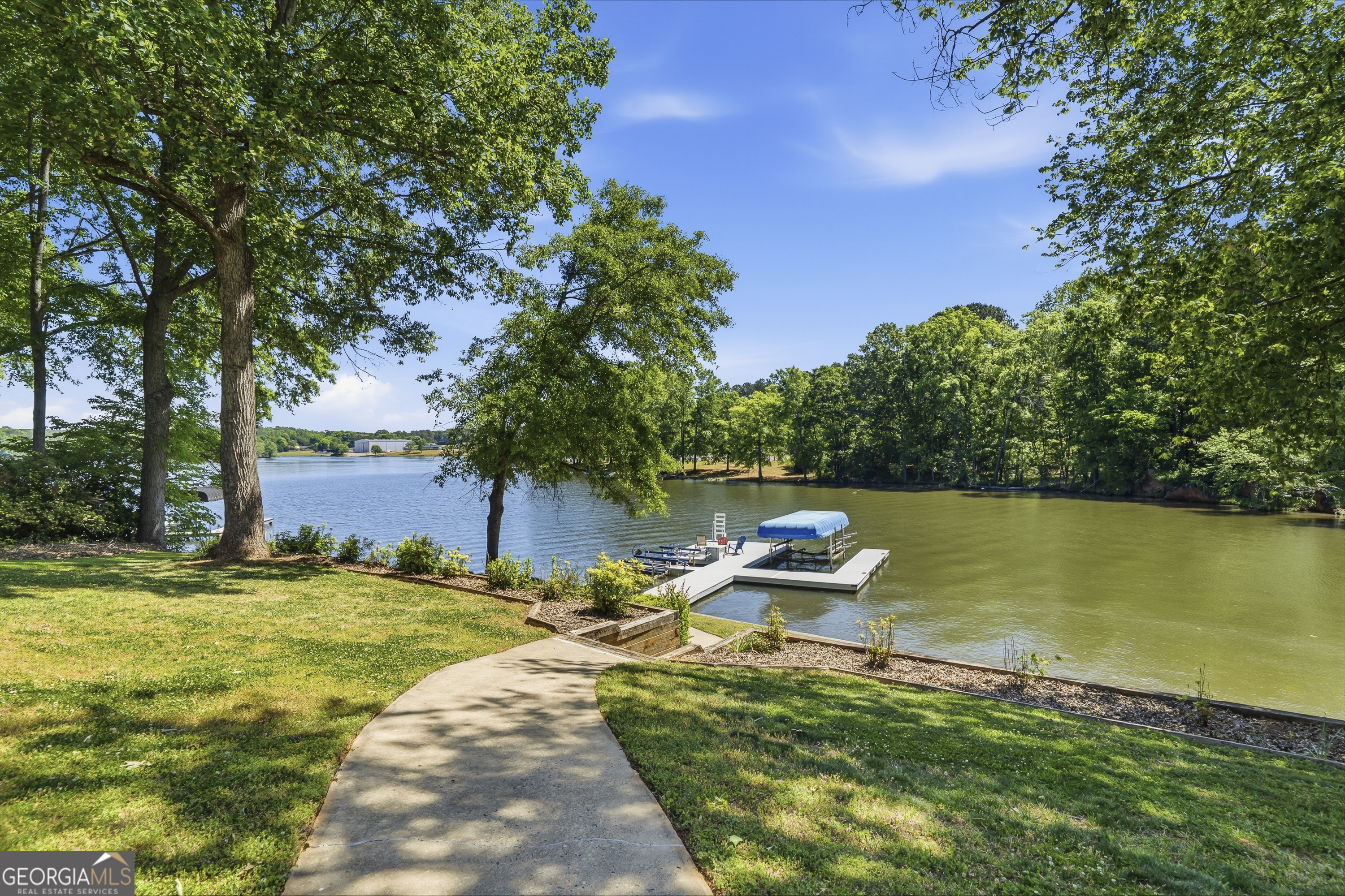 118 Hickory Point Buckhead, GA 30625 - Photo 50 of 69 a view of a lake with a yard