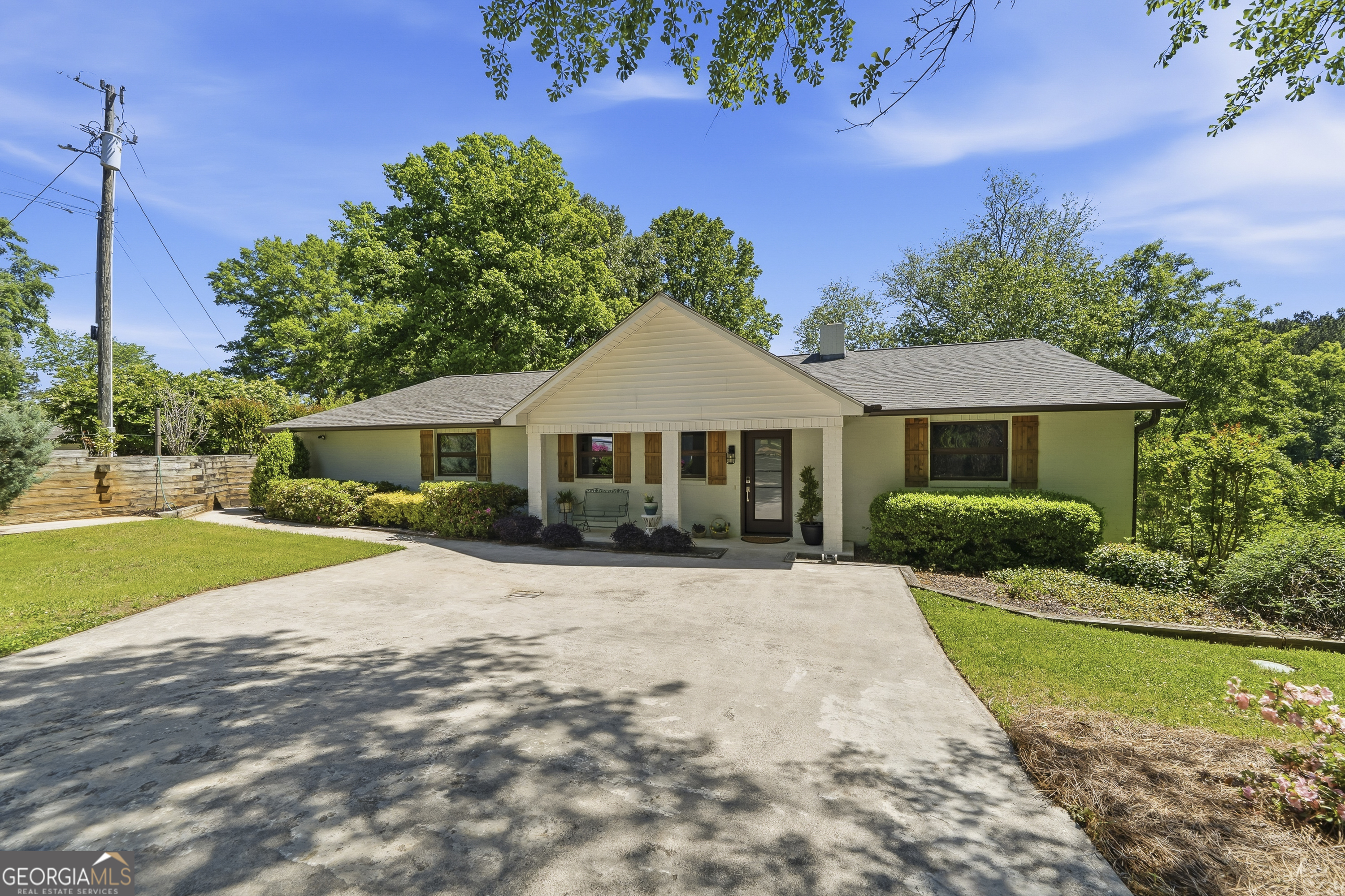 118 Hickory Point Buckhead, GA 30625 - Photo 7 of 69 a front view of a house with a garden