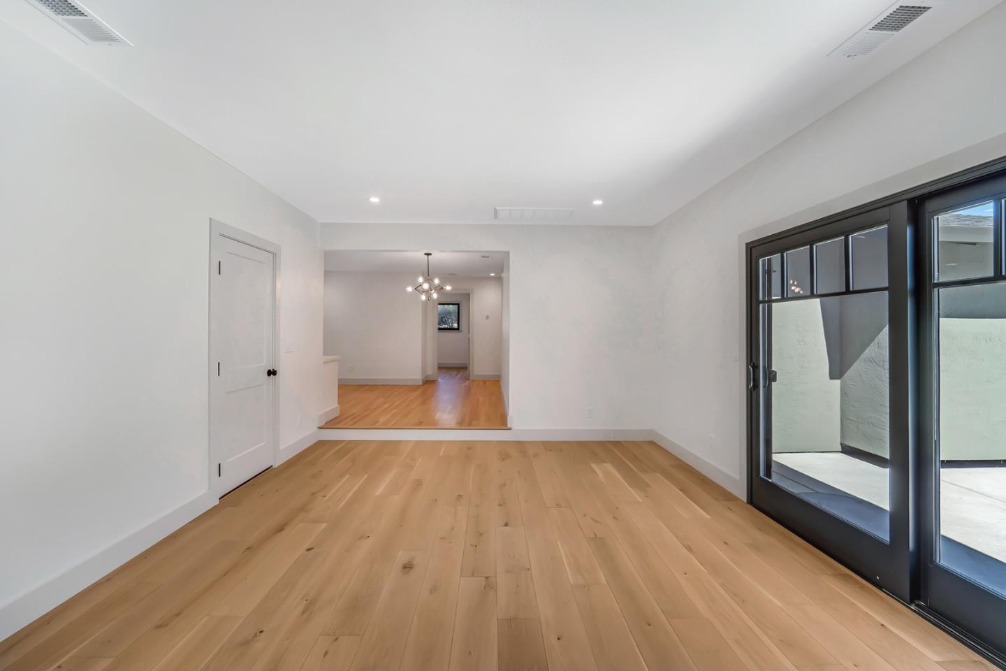 890 Quintinia Drive Sunnyvale, CA 94086 - Photo 16 of 37 wooden floor in an empty room with a window