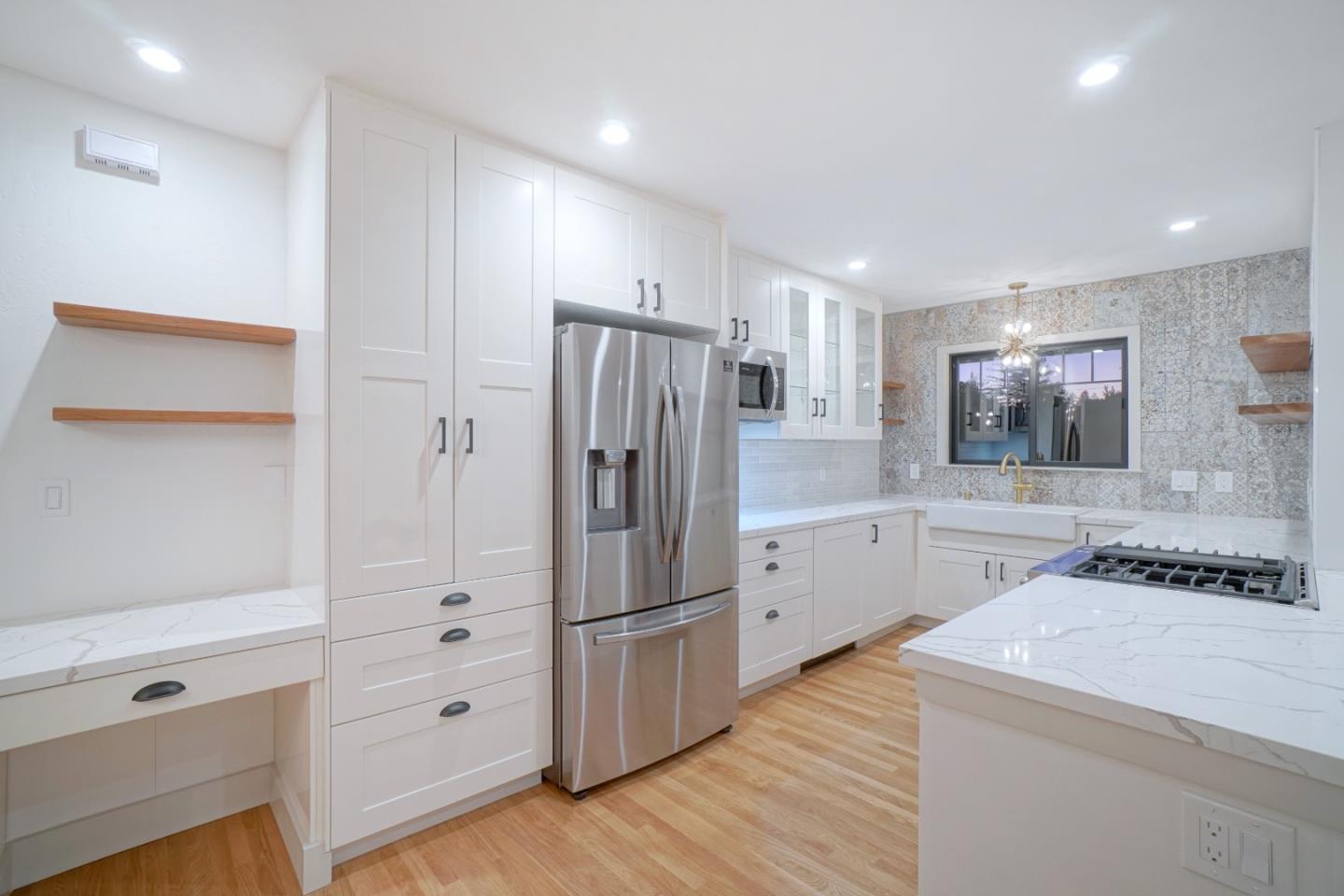 890 Quintinia Drive Sunnyvale, CA 94086 - Photo 2 of 37 a kitchen with granite countertop a refrigerator and a stove top oven
