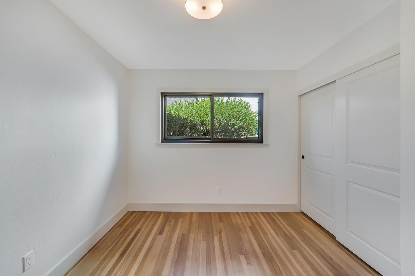 890 Quintinia Drive Sunnyvale, CA 94086 - Photo 21 of 37 a view of a room with wooden floor and windows