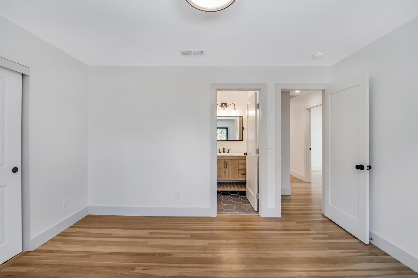 890 Quintinia Drive Sunnyvale, CA 94086 - Photo 24 of 37 a view of empty room with wooden floor
