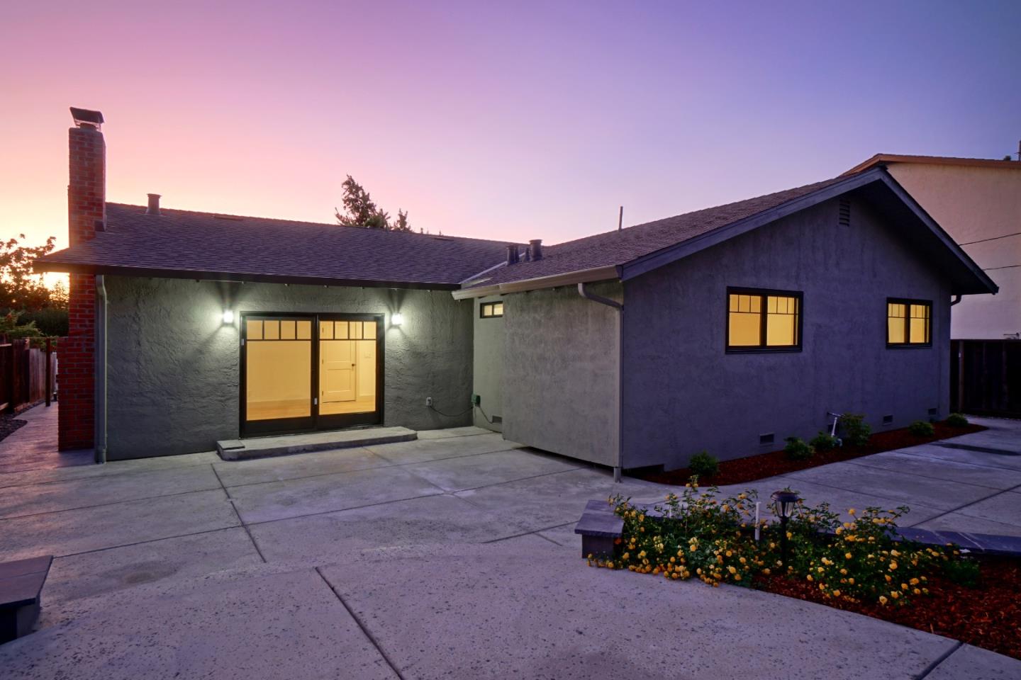 890 Quintinia Drive Sunnyvale, CA 94086 - Photo 28 of 37 a front view of a house with a yard