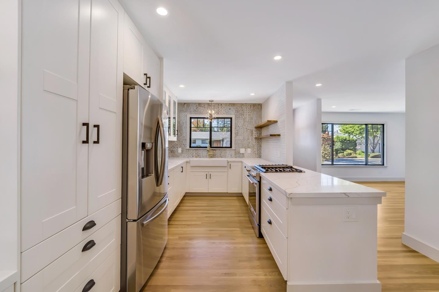 890 Quintinia Drive Sunnyvale, CA 94086 - Photo 3 of 37 a large kitchen with a lot of counter space and a sink
