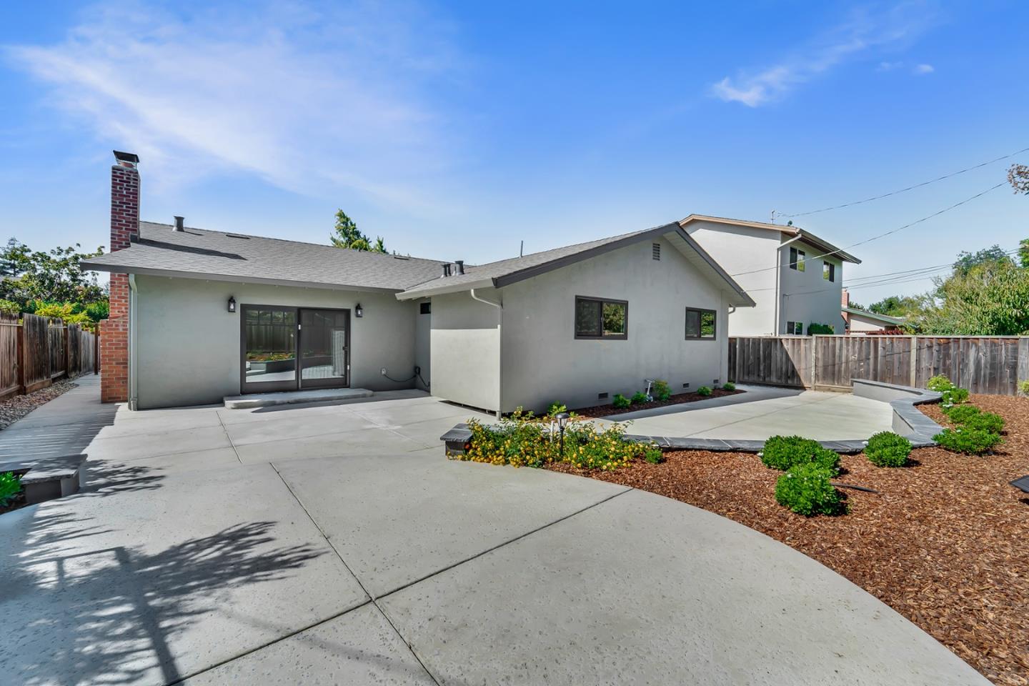 890 Quintinia Drive Sunnyvale, CA 94086 - Photo 31 of 37 a front view of a house with yard and a garage