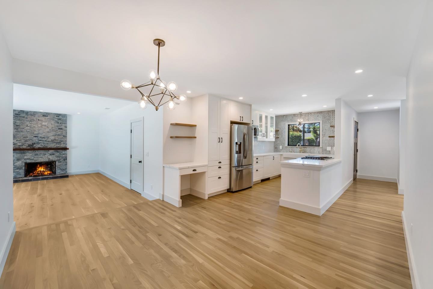 890 Quintinia Drive Sunnyvale, CA 94086 - Photo 4 of 37 a view of a kitchen with furniture and wooden floor