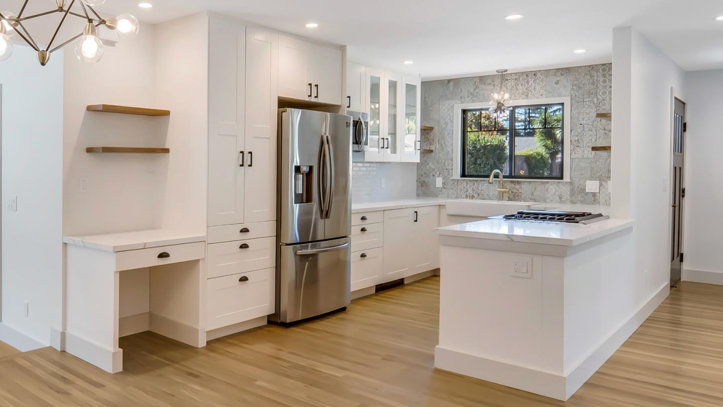 890 Quintinia Drive Sunnyvale, CA 94086 - Photo 5 of 37 a kitchen with white cabinets and refrigerator