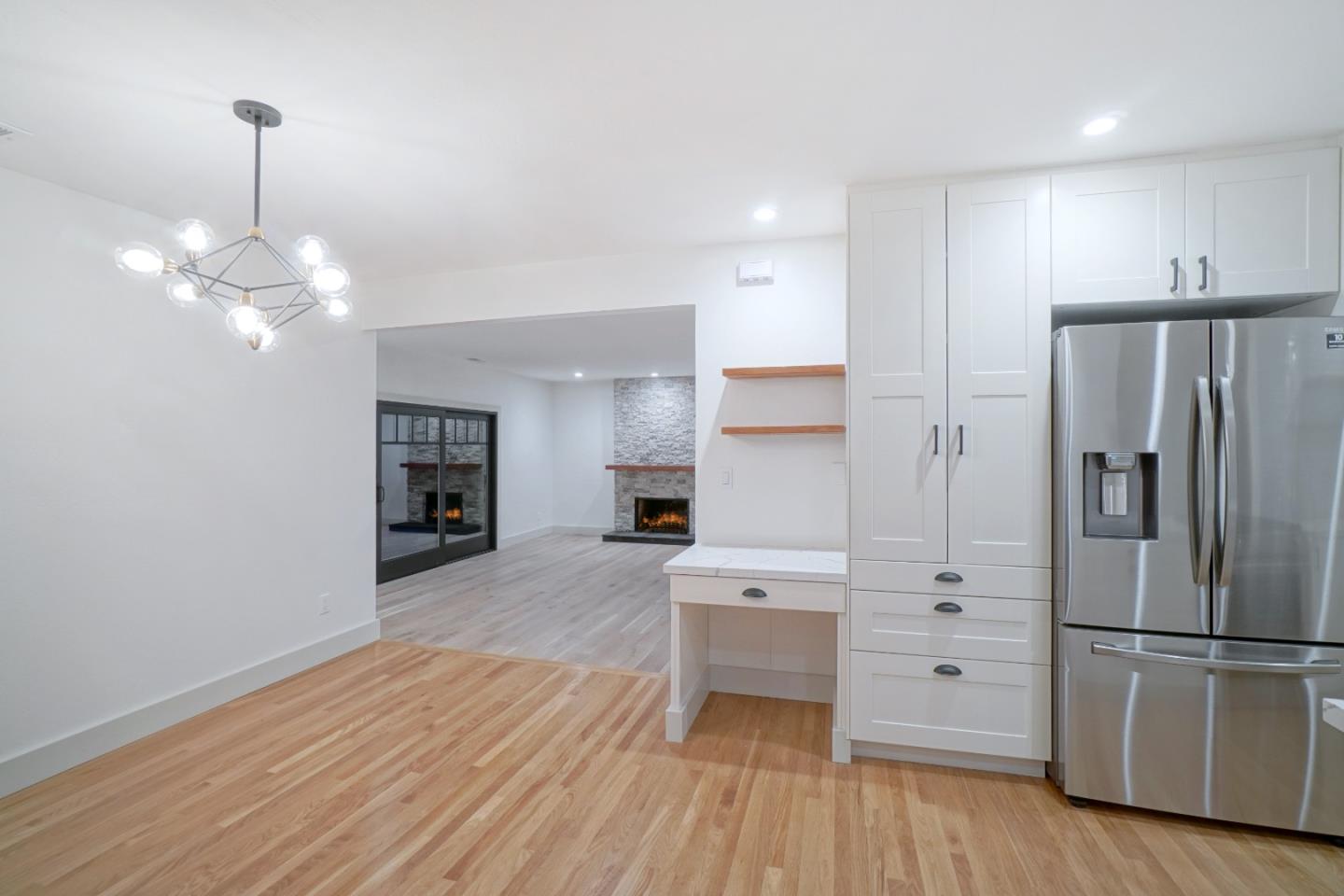 890 Quintinia Drive Sunnyvale, CA 94086 - Photo 8 of 37 a kitchen with stainless steel appliances a refrigerator and wooden floor