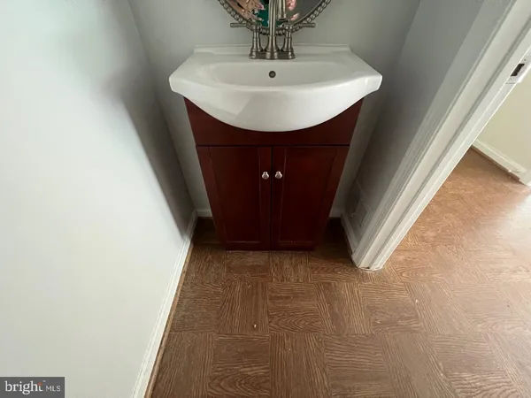 a bathroom with a sink and mirror