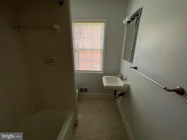 a bathroom with a sink and toilet
