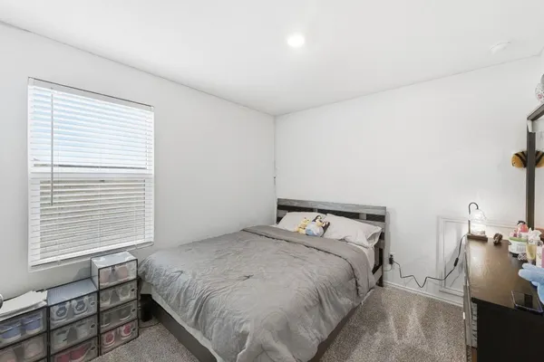 a view of walk in closet with clothes