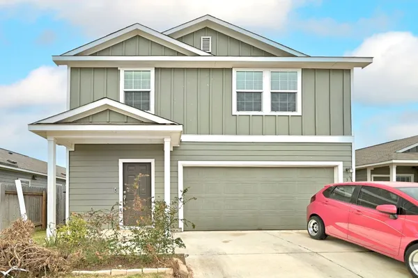a front view of a house with a garage