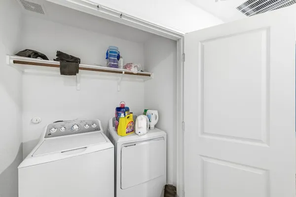 a bathroom with a sink a toilet a mirror and shower curtain