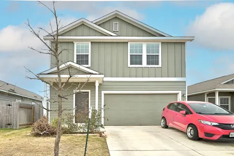 a front view of a house with parking