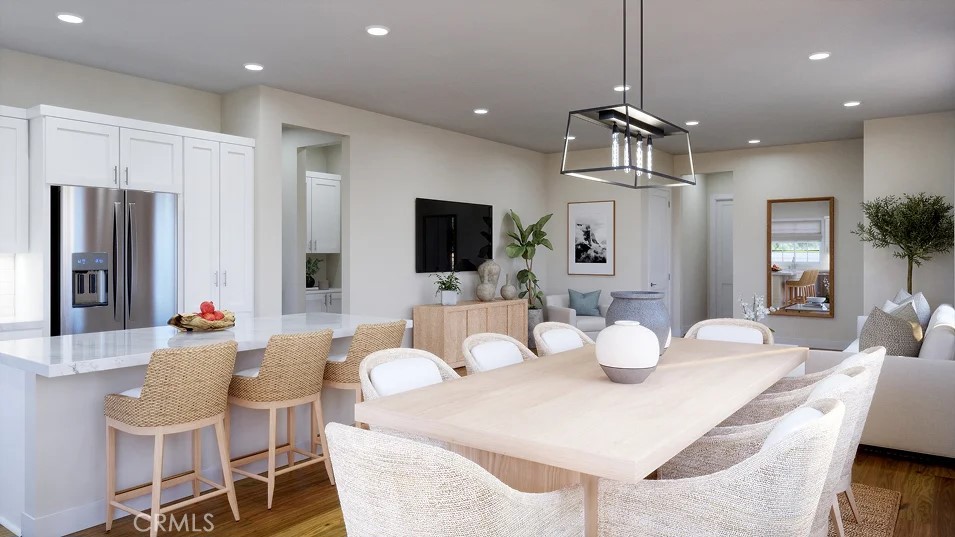 2312 Luminous Way Rancho Mission Viejo, CA 92694 - Photo 3 of 20 a view of a dining room with furniture and wooden floor