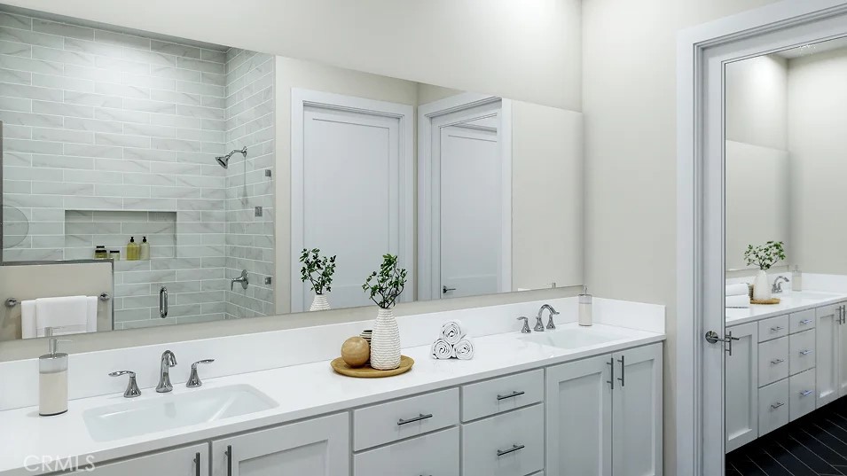 2312 Luminous Way Rancho Mission Viejo, CA 92694 - Photo 9 of 20 a bathroom with double sink and a mirror