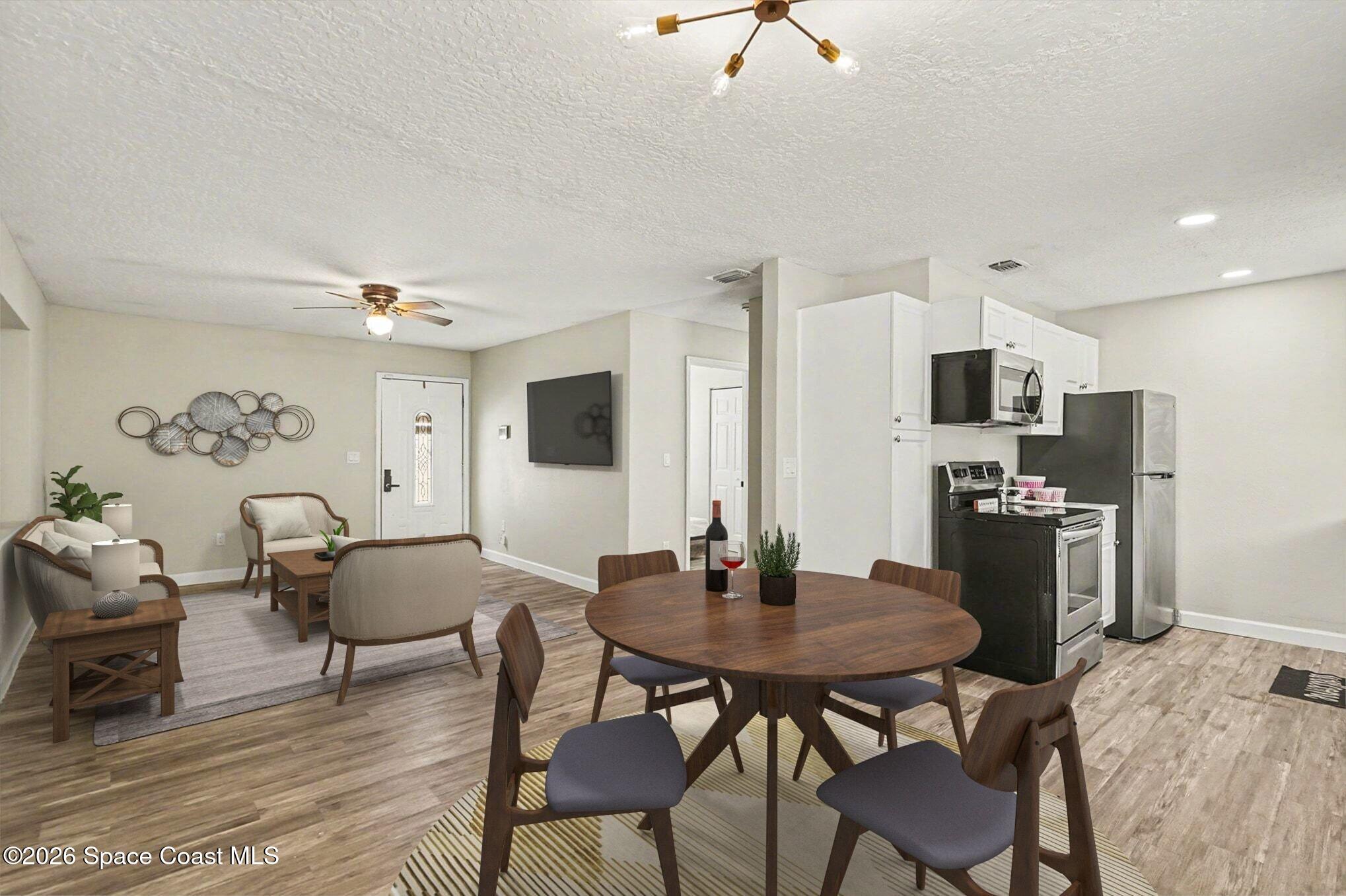 905 Poplar Lane Melbourne, FL 32901 - Photo 2 of 30 Staged Dining into Living