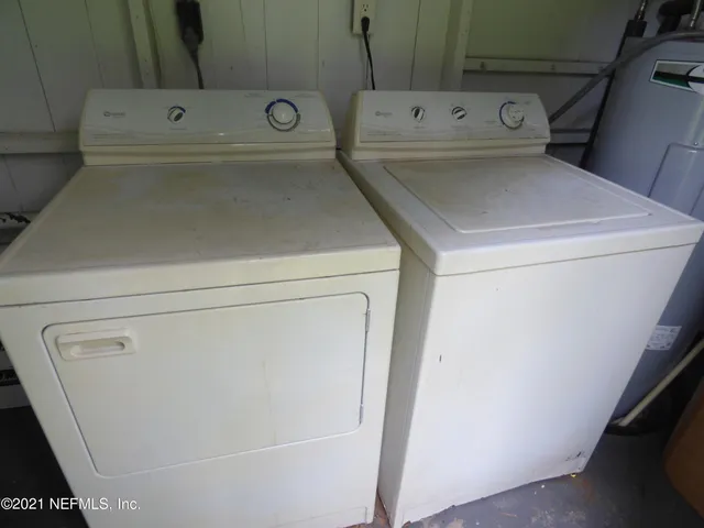a utility room with dryer and washer