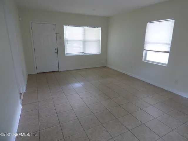 an empty room with windows