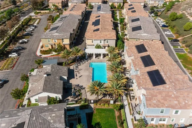 an aerial view of residential houses with outdoor space