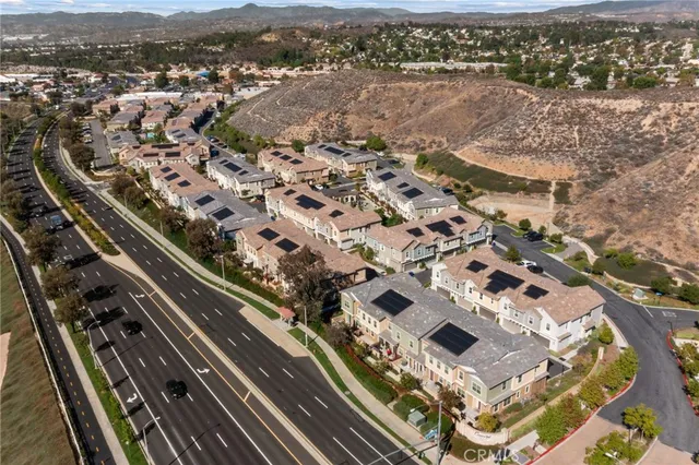 an aerial view of residential houses with outdoor space