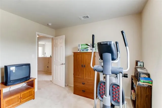 a view of living room with furniture and flat screen tv