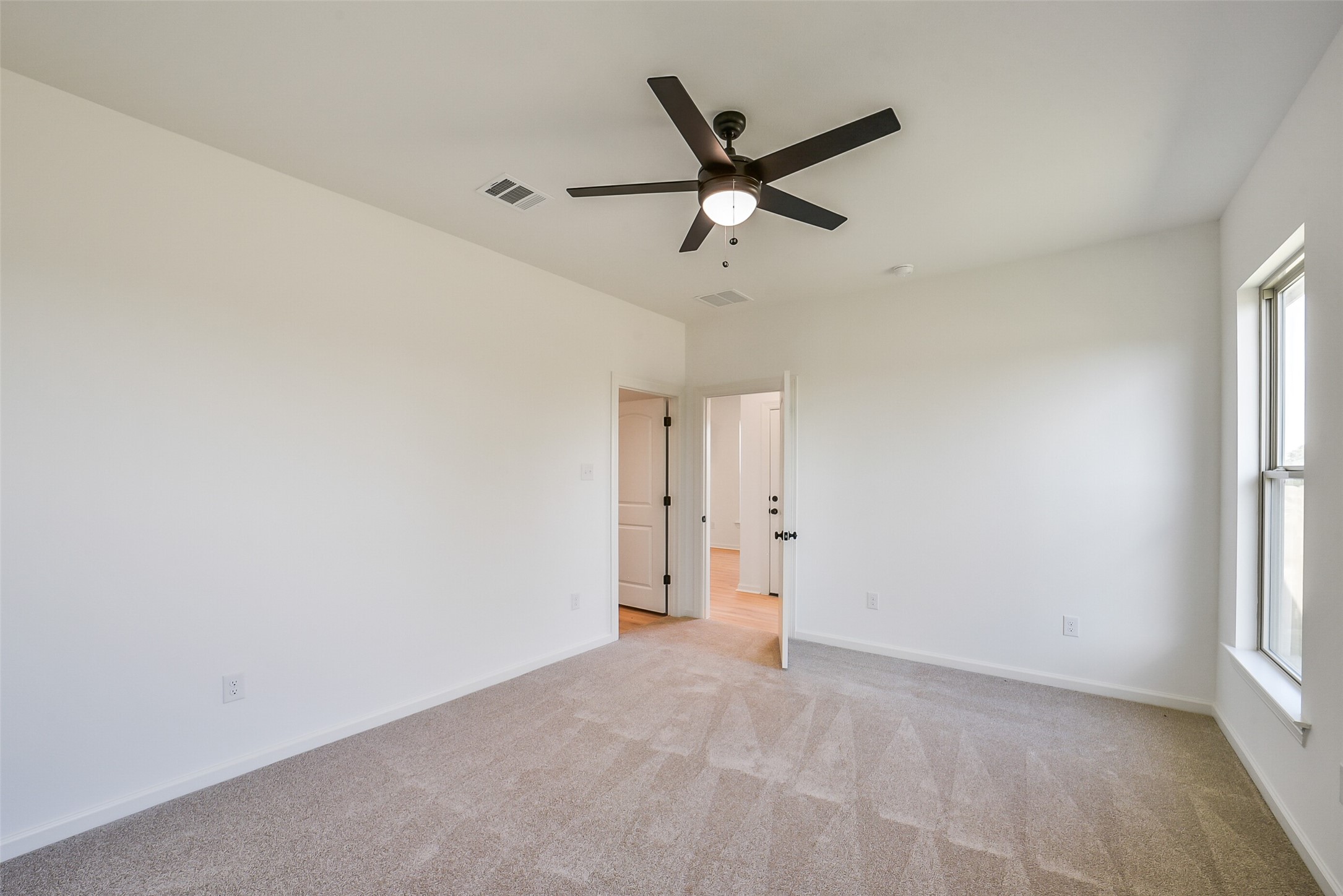40708 Pessi Road Magnolia, TX 77354 - Photo 16 of 30 an empty room with closet and windows