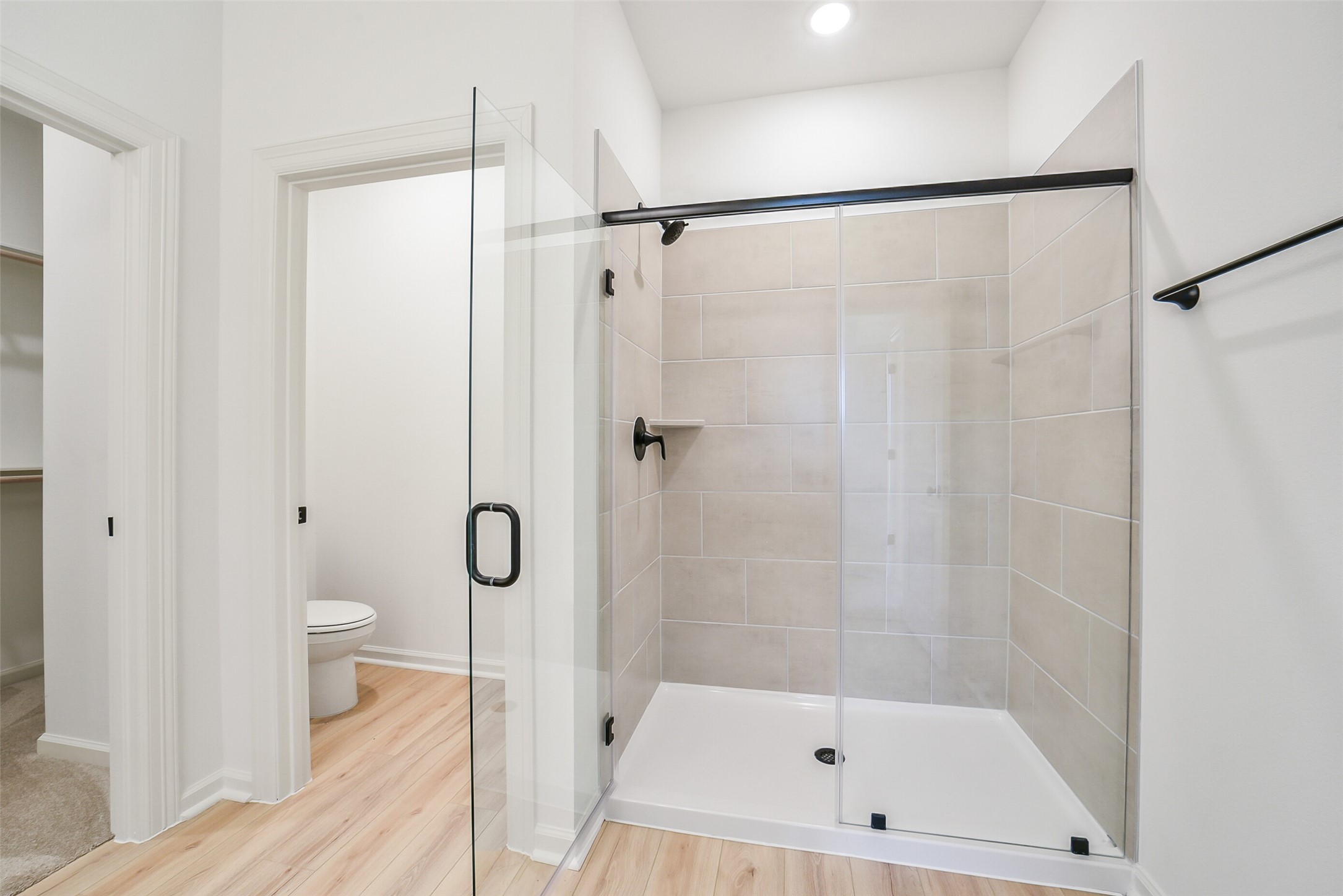 40708 Pessi Road Magnolia, TX 77354 - Photo 18 of 30 a bathroom with a shower a toilet and a shower