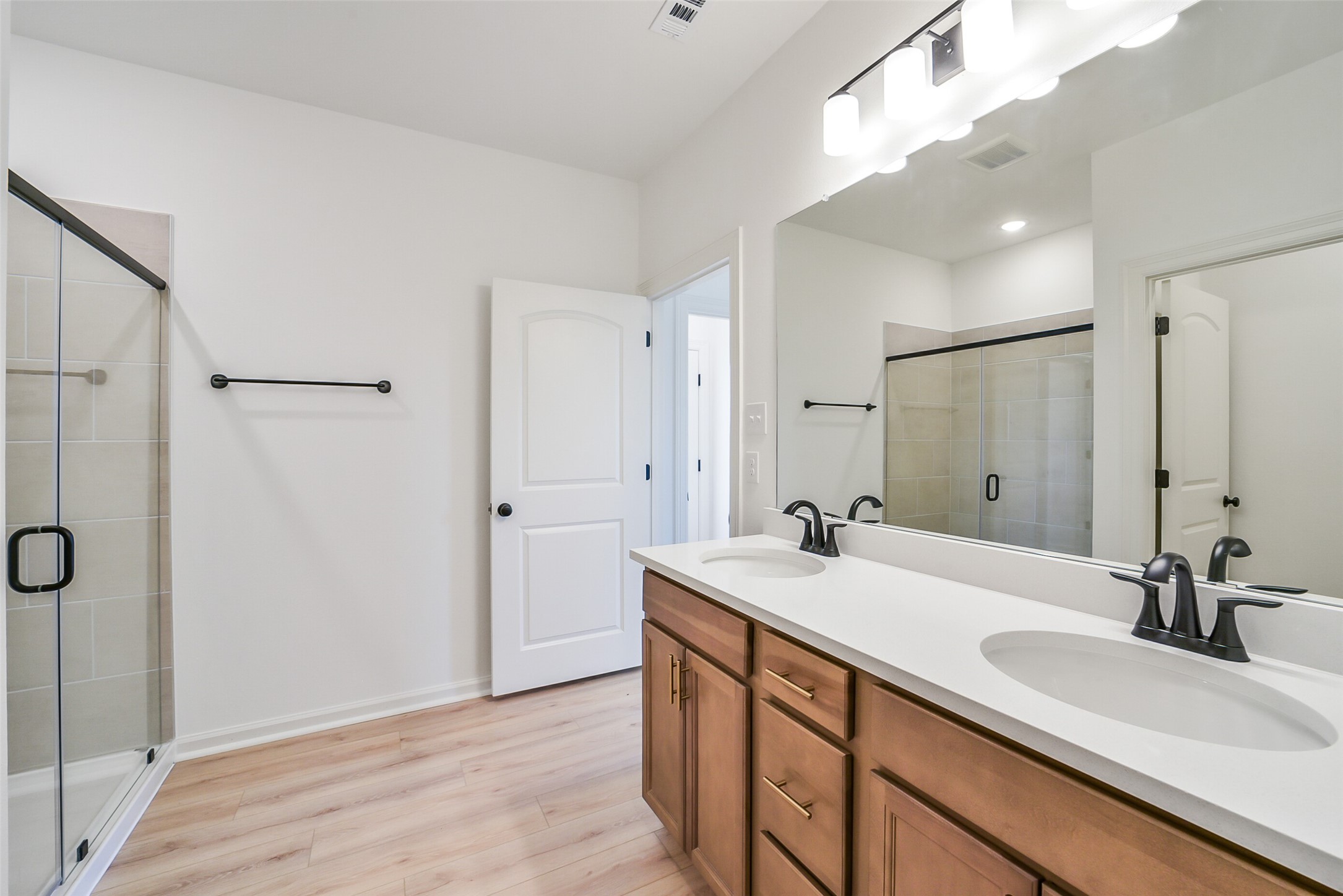 40708 Pessi Road Magnolia, TX 77354 - Photo 19 of 30 a bathroom with a sink double vanity and a mirror