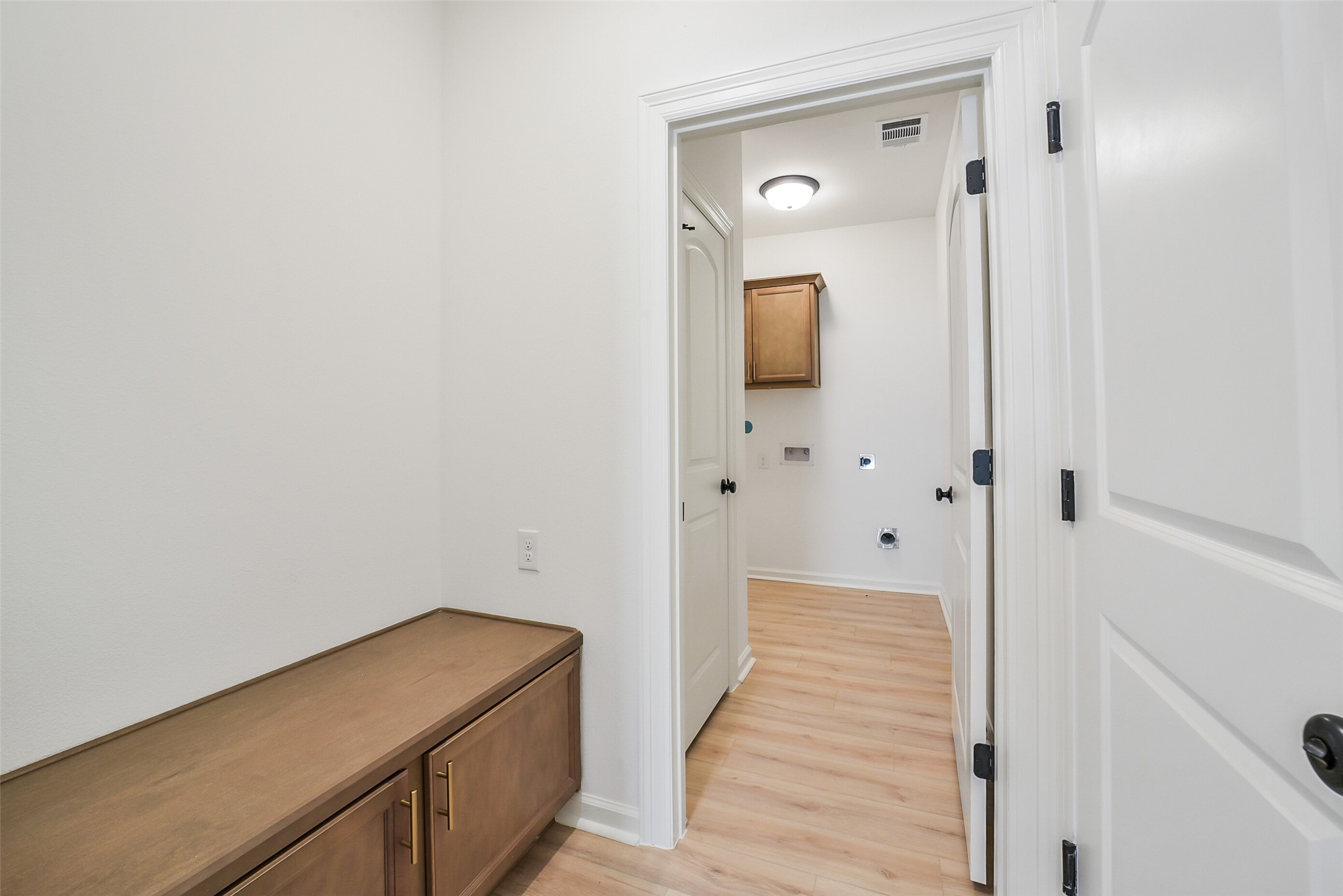 40708 Pessi Road Magnolia, TX 77354 - Photo 21 of 30 a hallway with wooden floor and closet
