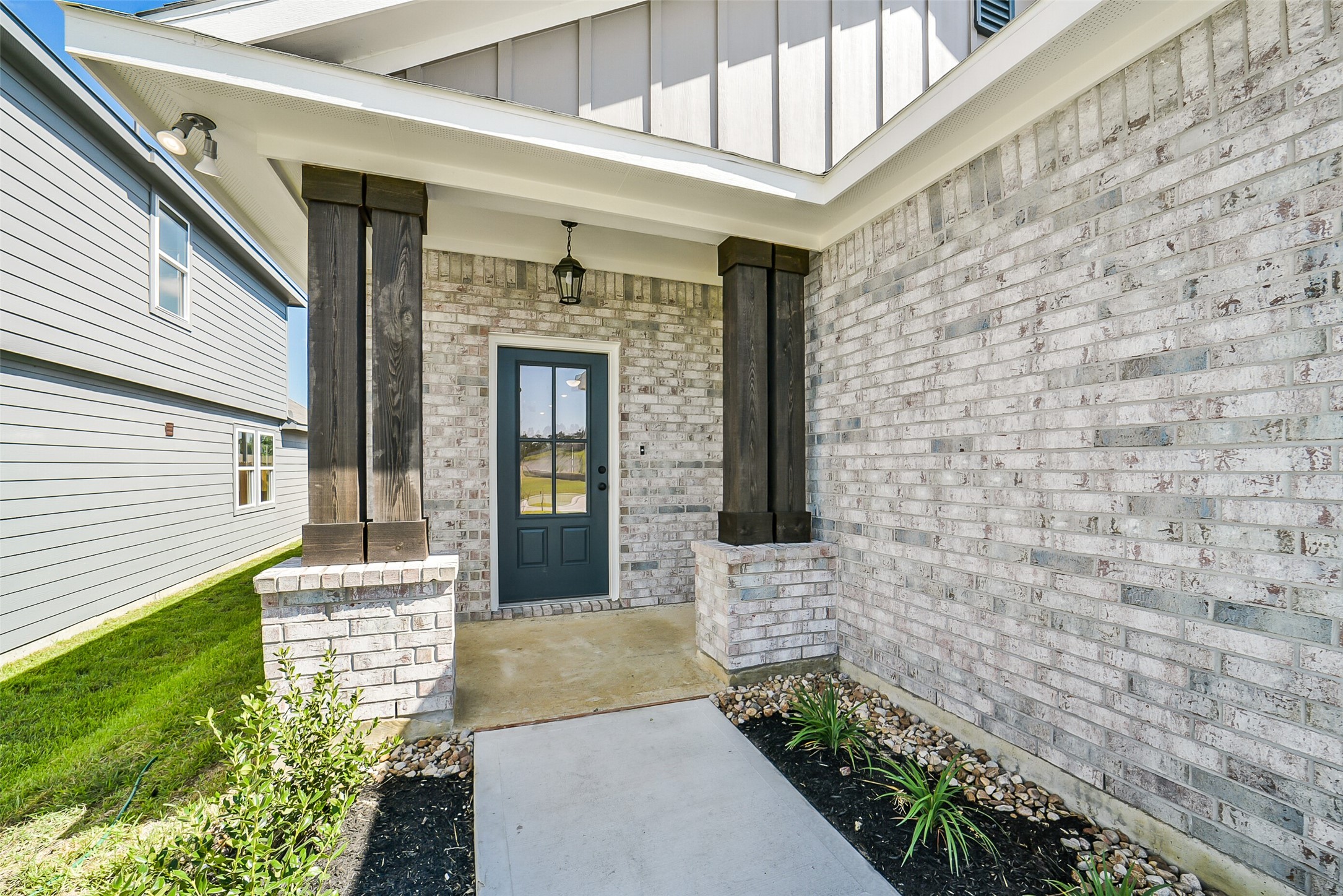 40708 Pessi Road Magnolia, TX 77354 - Photo 4 of 30 a front view of a house with a garden