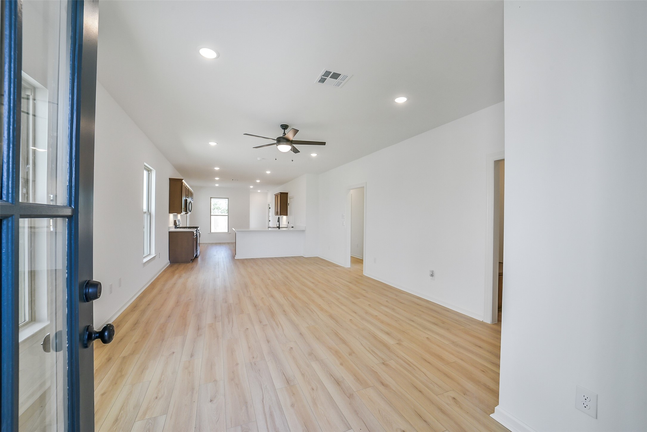 40708 Pessi Road Magnolia, TX 77354 - Photo 5 of 30 a view of empty room with wooden floor