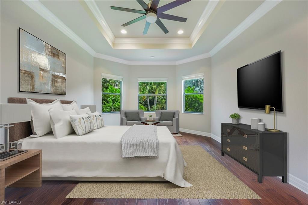 4609 Azalea Drive Naples, FL 34119 - Photo 20 of 45 a bedroom with a bed and a flat screen tv